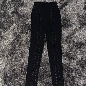 Stretchy black leggings with lace up detail